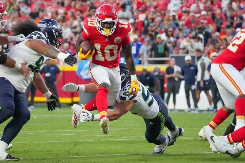 Aug 28, 2026; Kansas City, Missouri, USA; Seattle Seahawks linebacker Patrick O'Connell (52) misses the tackle as Kansas City Chiefs running back Emmett Johnson (10) runs the ball during the first half of the game at Arrowhead Stadium. Mandatory Credit:...