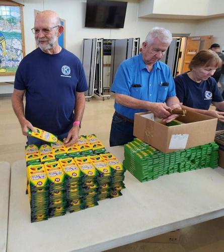 dobytown-backpacks-p3 - passing out crayons