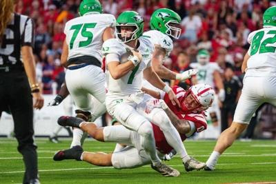 Sep 19, 2026; Lincoln, Nebraska, USA;  North Dakota Fighting Hawks quarterback Jerry Kaminski (1) is sacked by Nebraska Cornhuskers linebacker Owen Chambliss (0) during the second quarter at Memorial Stadium.  Mandatory Credit: Dylan Widger-Imagn Images