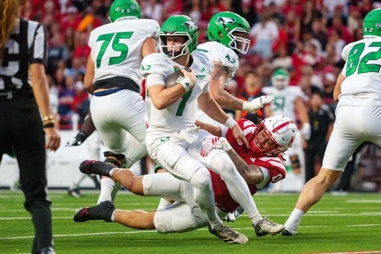 Sep 19, 2026; Lincoln, Nebraska, USA;  North Dakota Fighting Hawks quarterback Jerry Kaminski (1) is sacked by Nebraska Cornhuskers linebacker Owen Chambliss (0) during the second quarter at Memorial Stadium.  Mandatory Credit: Dylan Widger-Imagn Images