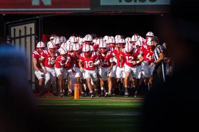 Sep 12, 2026; Lincoln, Nebraska, USA;  The Nebraska Cornhuskers run onto the field before the game against the Bowling Green Falcons at Memorial Stadium.  Mandatory Credit: Dylan Widger-Imagn Images