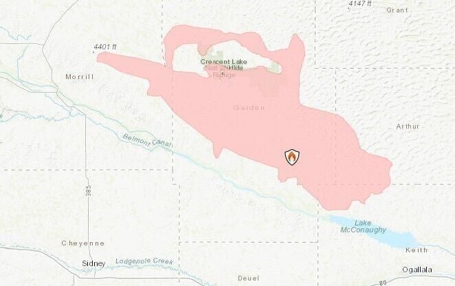 Winds calm, temperatures cool as firefighters days' old battle continues with three major fires