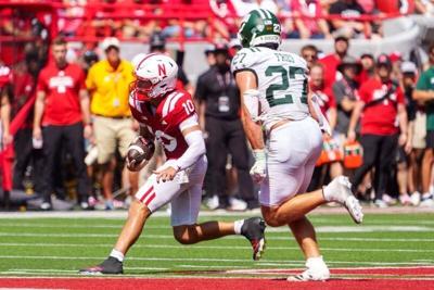 Sep 5, 2026; Lincoln, Nebraska, USA;  Nebraska Cornhuskers quarterback Anthony Colandrea (10) runs against Ohio Bobcats linebacker Jack Fries (27) during the second quarter at Memorial Stadium.  Mandatory Credit: Dylan Widger-Imagn Images