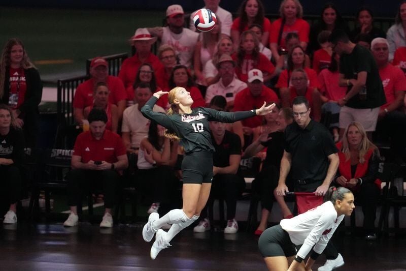 Aug 28, 2026; Arlington, TX, USA;  Nebraska Cornhuskers defensive specialist/libero Olivia Mauch (10) serves the ball during their volleyball match against the SMU Mustangs at AT&T Stadium.  Mandatory Credit: Chris Jones-Imagn Images