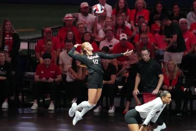 Aug 28, 2026; Arlington, TX, USA;  Nebraska Cornhuskers defensive specialist/libero Olivia Mauch (10) serves the ball during their volleyball match against the SMU Mustangs at AT&T Stadium.  Mandatory Credit: Chris Jones-Imagn Images