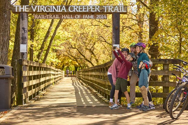 Visitors enjoy the Virginia Creeper Trail trailhead area in downtown Abingdon, Virginia.