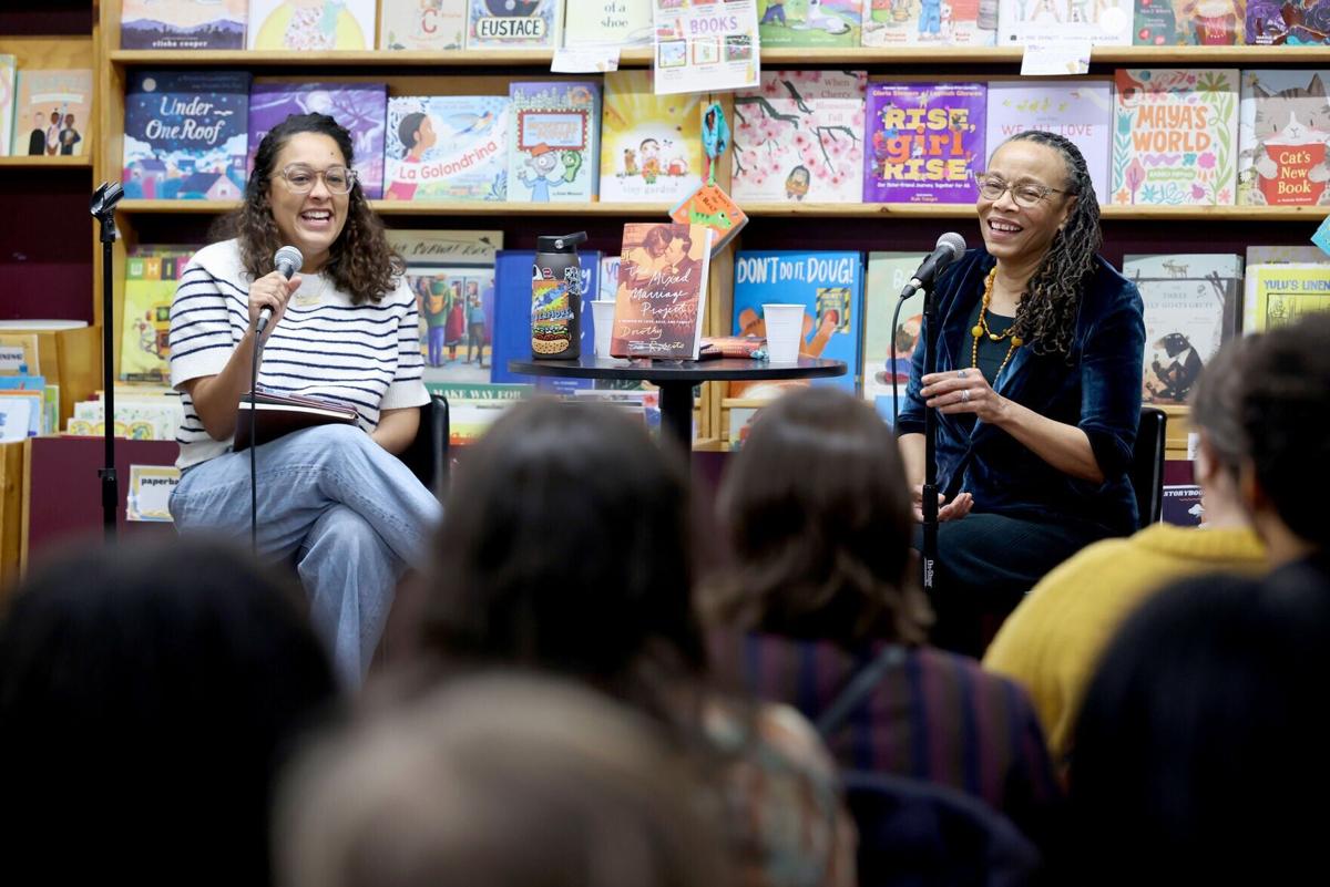 Eve L. Ewing, left, interviews author Dorothy Roberts during a reading and discussion of Roberts' new book, " The Mixed Marriage Project," at Women& Children First bookstore, Feb. 25, 2026, in Chicago.