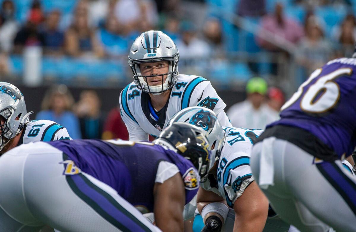 Carolina Panthers quarterback Sam Darnold under center against the Baltimore Ravens during the first half of a preseason game at Bank of America Stadium on Saturday, Aug. 21, 2021, in Charlotte, North Carolina.