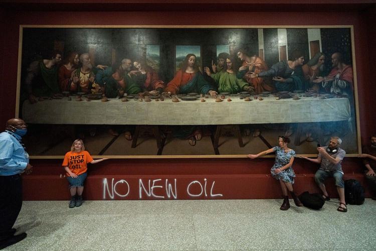Activists glue themselves to copy of Leonardo's 'The Last Supper,' adding to string of similar protests
