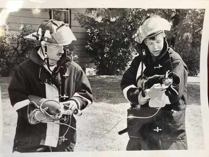Henningfeld helping cat after fire