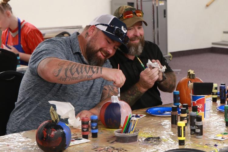 Veterans join Club Whatever members for pumpkin-painting activity