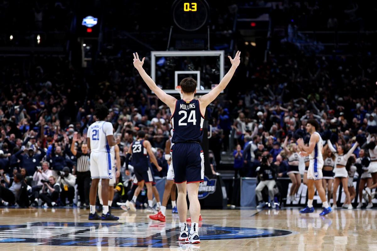 Braylon Mullins #24 of the UConn Huskies celebrates after shooting the game-winning three point basket during the second half of a game against the Duke Blue Devils in the Elite Eight of the 2026 NCAA Men's Basketball Tournament at Capital One Arena on ...