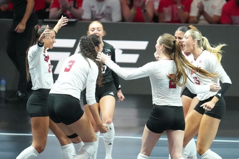 Aug 27, 2026; Arlington, TX, USA;  Nebraska Cornhuskers players celebrate a point during their volleyball match against the SMU Mustangs at AT&T Stadium.  Mandatory Credit: Chris Jones-Imagn Images
