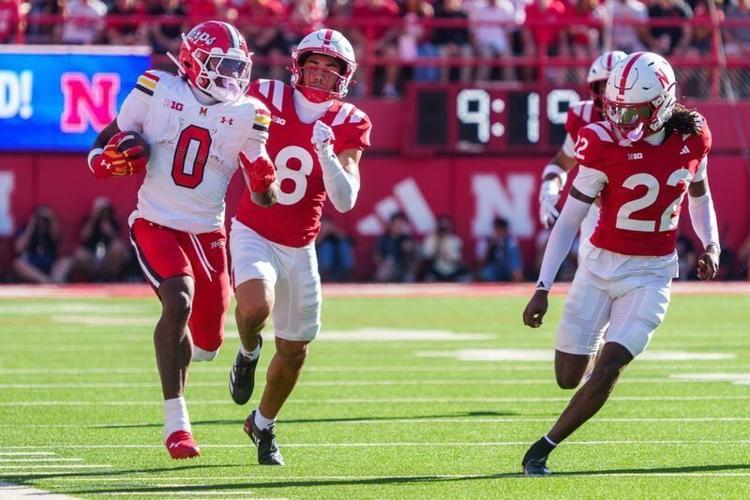 Oct 3, 2026; Lincoln, Nebraska, USA;  Maryland Terrapins running back DeJuan Williams (0) runs against Nebraska Cornhuskers defensive back Donovan Jones (8) and defensive back Victor Evans III (22) during the second quarter at Memorial Stadium.  Mandato...