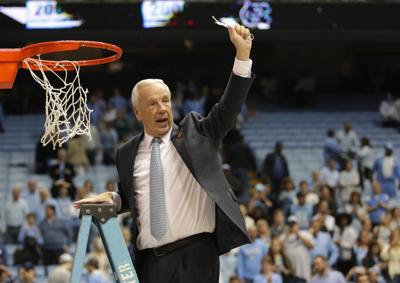 Head coach Roy Williams of the North Carolina Tar Heels celebrates as he cuts down the net after defeating the Duke Blue Devils 90-83 to clinch the ACC regular season title at the Dean Smith Center on March 4, 2017 in Chapel Hill, North Carolina.