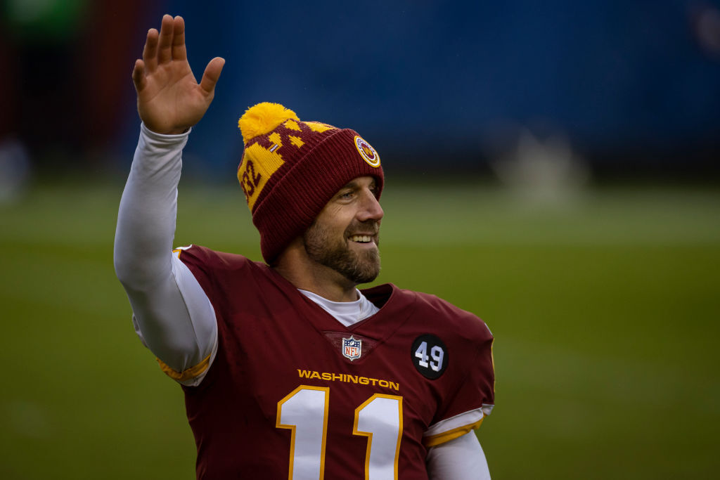 Alex Smith #11 of the Washington Football Team waves after the game against the Dallas Cowboys at FedExField on October 25, 2020 in Landover, Maryland.