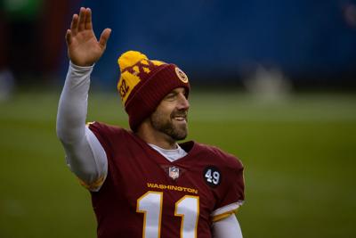 Alex Smith #11 of the Washington Football Team waves after the game against the Dallas Cowboys at FedExField on October 25, 2020 in Landover, Maryland.