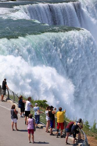A view of Niagara Falls from the air, by boat and on foot