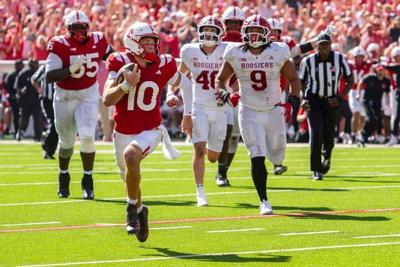 Oct 10, 2026; Lincoln, Nebraska, USA;  Nebraska Cornhuskers quarterback Anthony Colandrea (10) runs for a touchdown against the Indiana Hoosiers during the fourth quarter at Memorial Stadium.  Mandatory Credit: Dylan Widger-Imagn Images