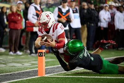 Oct 17, 2026; Eugene, Oregon, USA; Nebraska Cornhuskers quarterback Anthony Colandrea (10)    scores a touchdown during the second half against Oregon Ducks defensive back Ify Obidegwu (7) at Autzen Stadium. Mandatory Credit: Troy Wayrynen-Imagn Images