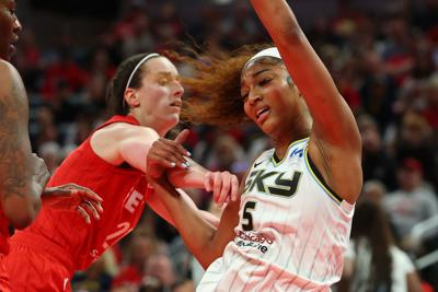 The Chicago Sky's Angel Reese takes a hard foul from the Indiana Fever's Caitlin Clark in the second half at Gainbridge Fieldhouse on May 17, 2025, in Indianapolis.