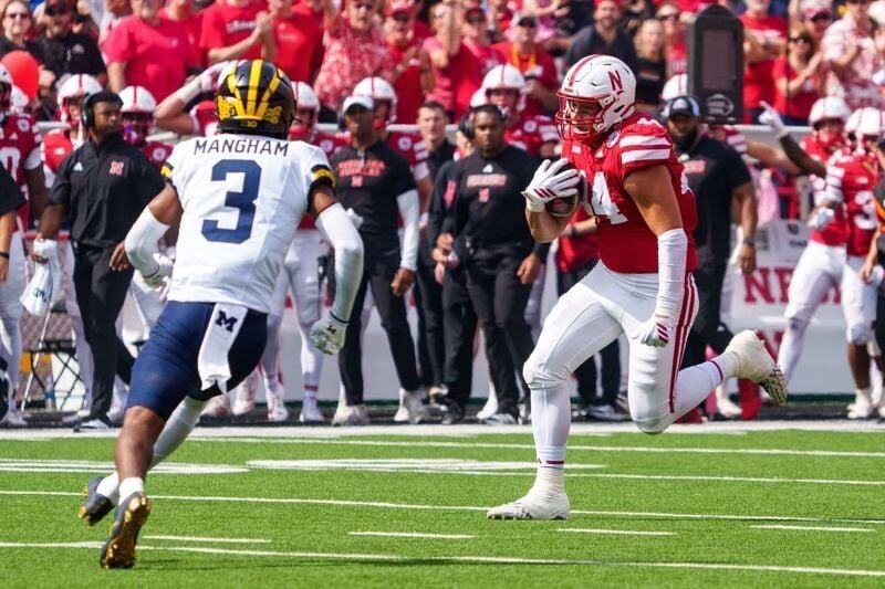 Sep 20, 2025; Lincoln, Nebraska, USA; Nebraska Cornhuskers tight end Luke Lindenmeyer (44) runs against Michigan Wolverines defensive back Jaden Mangham (3) during the first quarter at Memorial Stadium. Mandatory Credit: Dylan Widger-Imagn Images