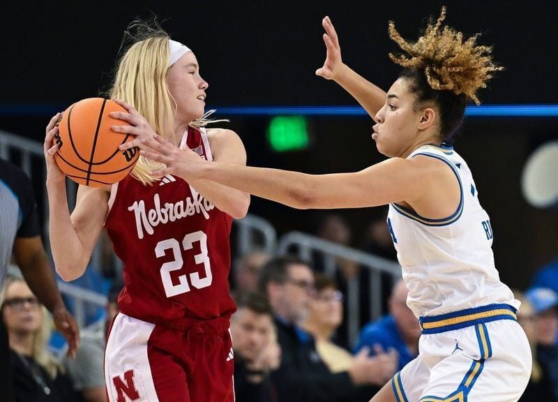 Dec 29, 2024; Los Angeles, California, USA; UCLA Bruins guard Kiki Rice (1) defends against Nebraska Cornhuskers guard Britt Prince (23) during the fourth quarter at Pauley Pavilion presented by Wescom. Mandatory Credit: Robert Hanashiro-Imagn Images