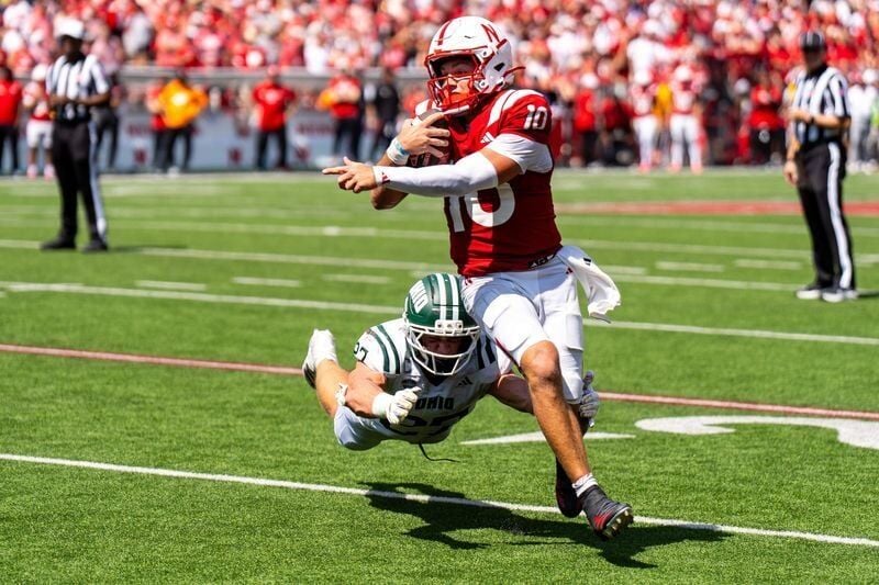 Sep 5, 2026; Lincoln, Nebraska, USA;  Nebraska Cornhuskers quarterback Anthony Colandrea (10) runs for a touchdown against Ohio Bobcats linebacker Jack Fries (27) during the third quarter at Memorial Stadium.  Mandatory Credit: Dylan Widger-Imagn Images