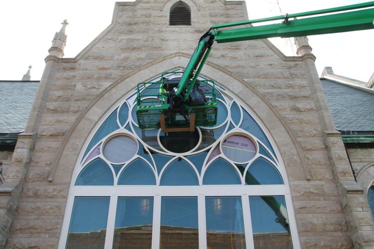 Installing New 1 inch insulated low E protective glass.JPG