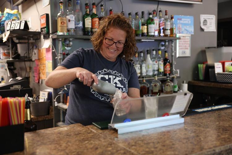 Chelsea Kallenbach refilling a drink