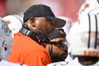 Sep 20, 2025; Louisville, Kentucky, USA;  Bowling Green Falcons head coach Eddie George talks with his players during the first quarter against the Louisville Cardinals at L&N Federal Credit Union Stadium. Mandatory Credit: Jamie Rhodes-Imagn Images