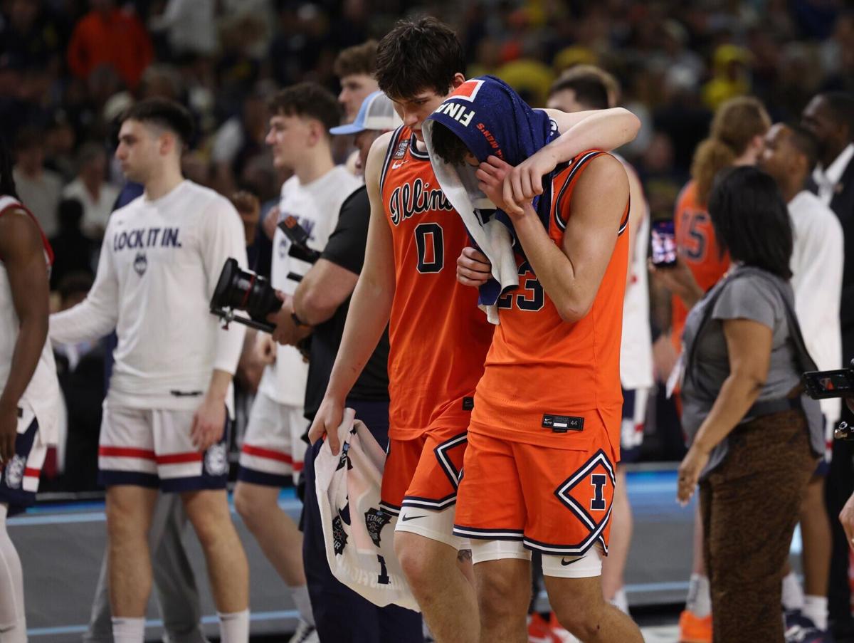 Illinois' David Mirkovic, left, and Keaton Wagler walk off the court after a 71-62 loss to UConn in the Final Four of the NCAA Tournament on Saturday, April 4, 2026, at Lucas Oil Stadium in Indianapolis.