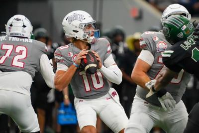Dec 23, 2025; Frisco, TX, USA; UNLV Rebels quarterback Anthony Colandrea (10) looks downfield against the Ohio Bobcats during the first half at the Ford Center at The Star. Mandatory Credit: Raymond Carlin III-Imagn Images