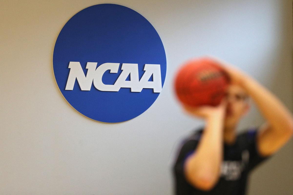 The NCAA logo is seen on the wall as Yeshiva players warmup prior to playing against Worcester Polytechnic Institute during the NCAA Division III Men's Basketball Championship - First Round at Goldfarb Gymnasium on at Johns Hopkins University on March 6, 2020 in Baltimore, Maryland.