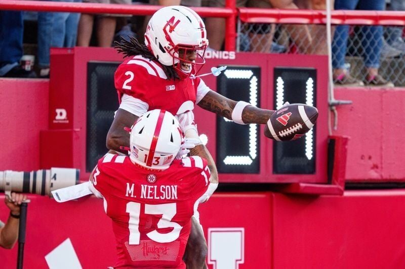 Sep 12, 2026; Lincoln, Nebraska, USA;  Nebraska Cornhuskers wide receiver Jacory Barney Jr. (2) and running back Mekhi Nelson (13) celebrate after a touchdown against the Bowling Green Falcons during the first quarter at Memorial Stadium.  Mandatory Cre...