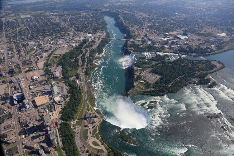A view of Niagara Falls from the air, by boat and on foot