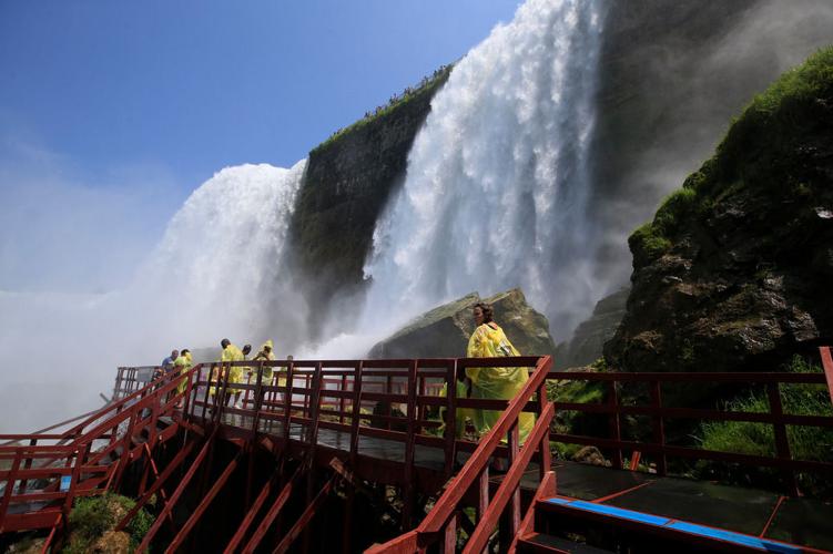 A view of Niagara Falls from the air, by boat and on foot
