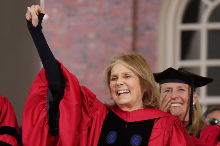 FILE PHOTO: Gloria Steinem salutes the graduating students as she receives and honorary Doctor of Humane Letters during Harvard University's 371st Commencement Exercises