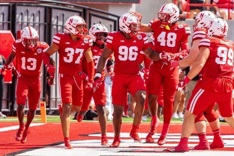 Sep 13, 2025; Lincoln, Nebraska, USA; Nebraska Cornhuskers defensive lineman Williams Nwaneri (96) and defensive back Caden VerMaas (48) celebrate after a fumble return for a touchdown against the Houston Christian Huskies during the second quarter at M...