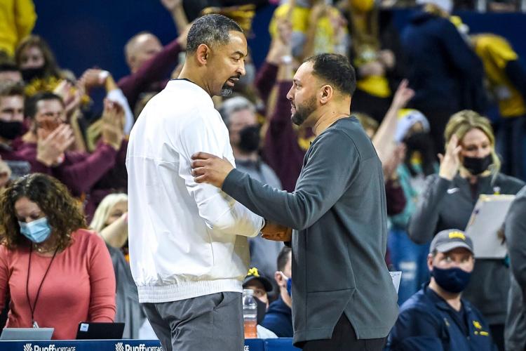 Michigan head coach Juwan Howard, left, shakes hands with Minnesota head coach Ben Johnson after the game at Crisler Arena on Saturday, Dec. 11, 2021, in Ann Arbor, Michigan.