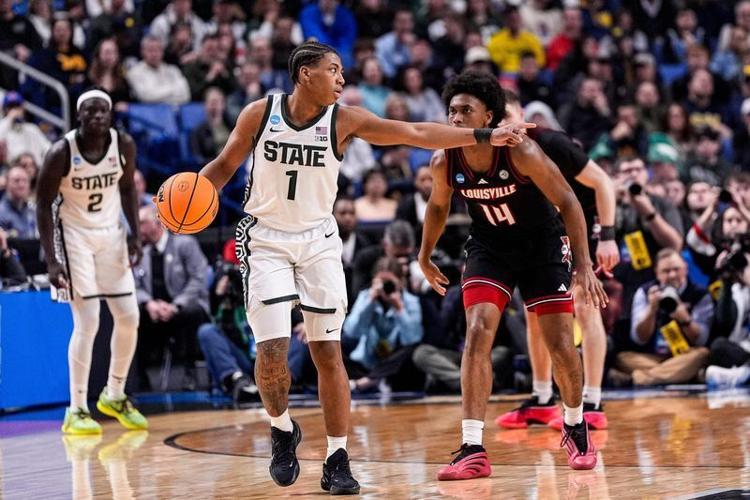 Michigan State guard Jeremy Fears Jr. (1) looks to pass against Louisville guard Adrian Wooley (14) during the 2026 NCAA men's tournament at KeyBank Center in Buffalo, N.Y.