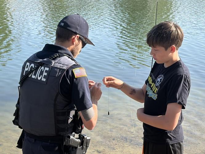 Officers and residents bond over fishing at first Cops and Bobbers event