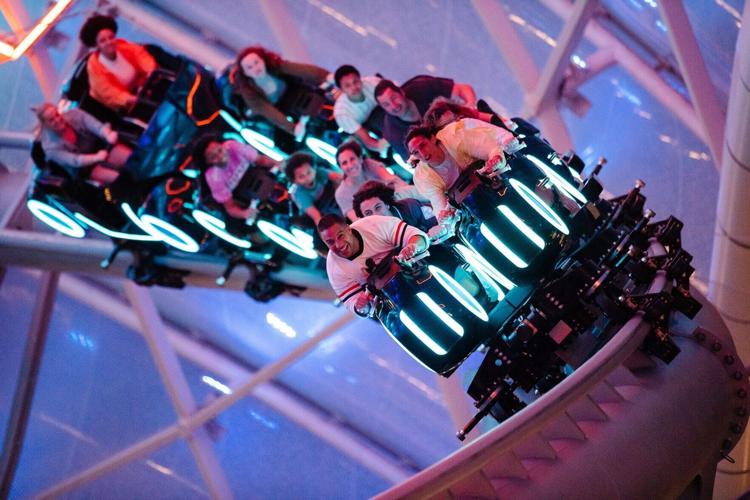 Magic Kingdom visitors hang on during the Tron Lightcycle/ Run coaster during a Disney After Hours event at Magic Kingdom theme park.