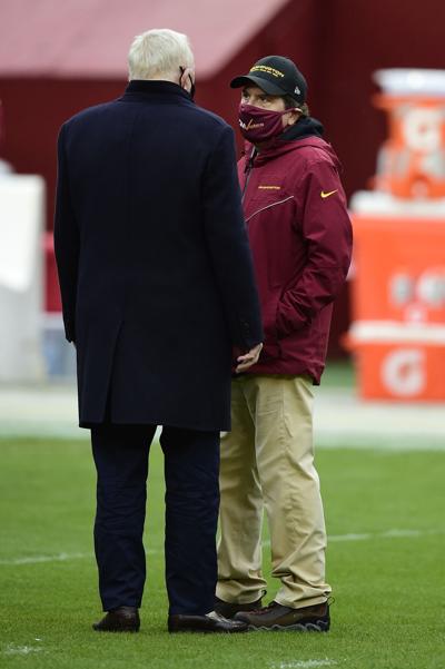 In this photo from October 25, 2020, Jerry Jones, left, the owner of the Dallas Cowboys, talks with Daniel Snyder, right, owner of the Washington Football Team, before the game at FedExField in Landover, Maryland.