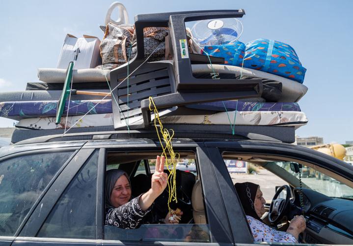 Displaced people make their way back to their homes in southern Lebanon following a deal between the U.S. and Iran, in highway of Sidon