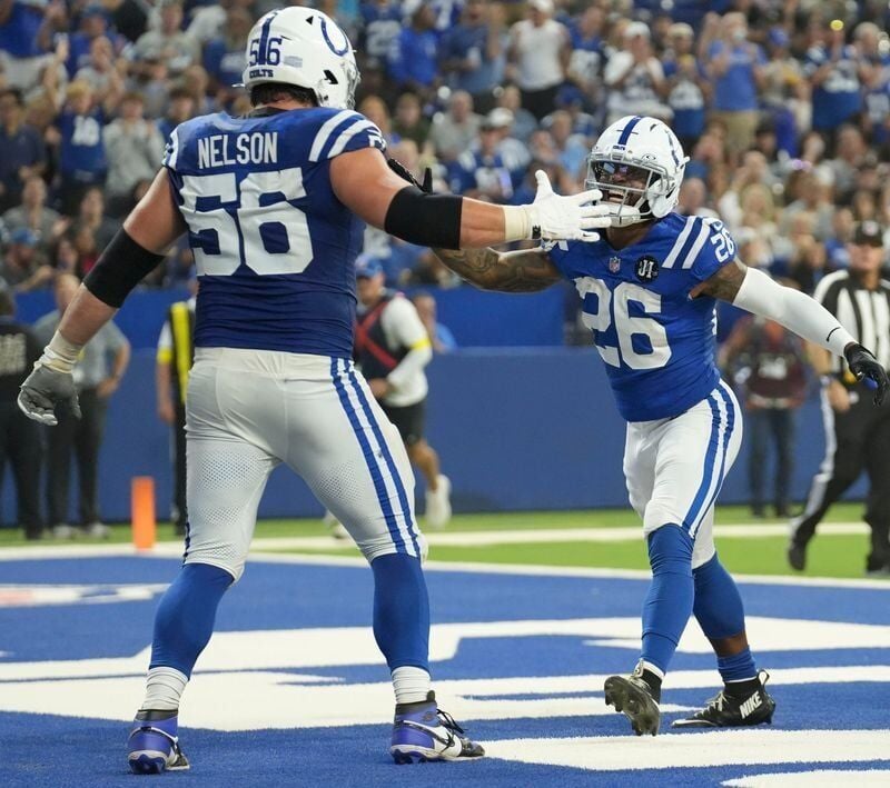 Indianapolis Colts guard Quenton Nelson (56) and Indianapolis Colts running back Ameer Abdullah (26) celebrate after Abdullah scores a touchdown Sunday, Oct. 5, 2025, during a game at Lucas Oil Stadium in Indianapolis. The Colts defeated the Raiders 40-6.