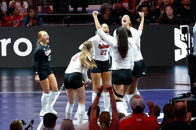 Aug 27, 2026; Arlington, TX, USA;  Nebraska Cornhuskers players celebrate a point during their volleyball match against the Florida Gators at AT&T Stadium.  Mandatory Credit: Chris Jones-Imagn Images