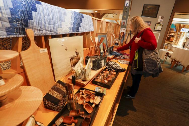 A visitor browses a selection of artisan items at the Southwest Virginia Cultural Center & Marketplace.