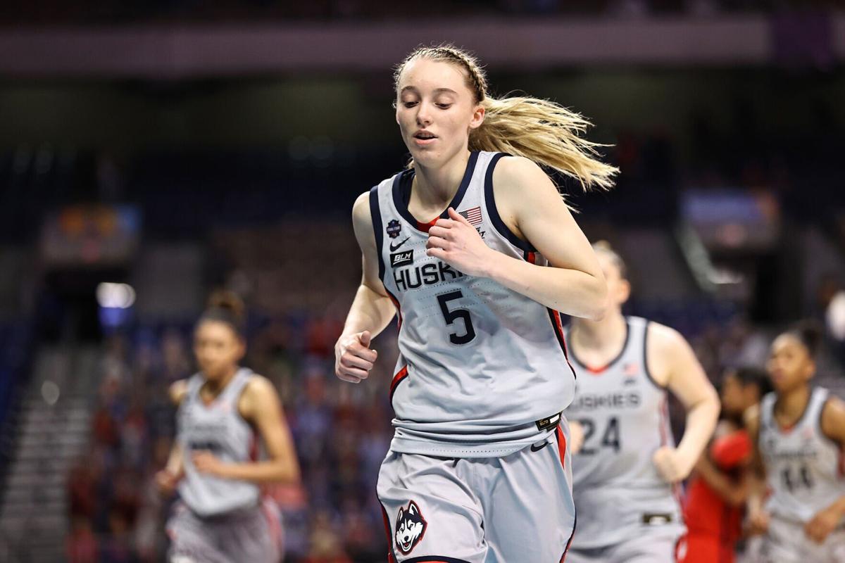 In this file photo, Connecticut's Paige Bueckers runs off of the court after a loss to Arizona in the Final Four semifinal of the NCAA Tournament at the Alamodome on April 2, 2021, in San Antonio.
