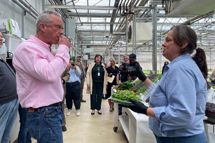 Health and Human Services Secretary Robert F. Kennedy Jr. samples microgreens at a Huron, Ohio, farm that rejects chemical use in growing its produce.